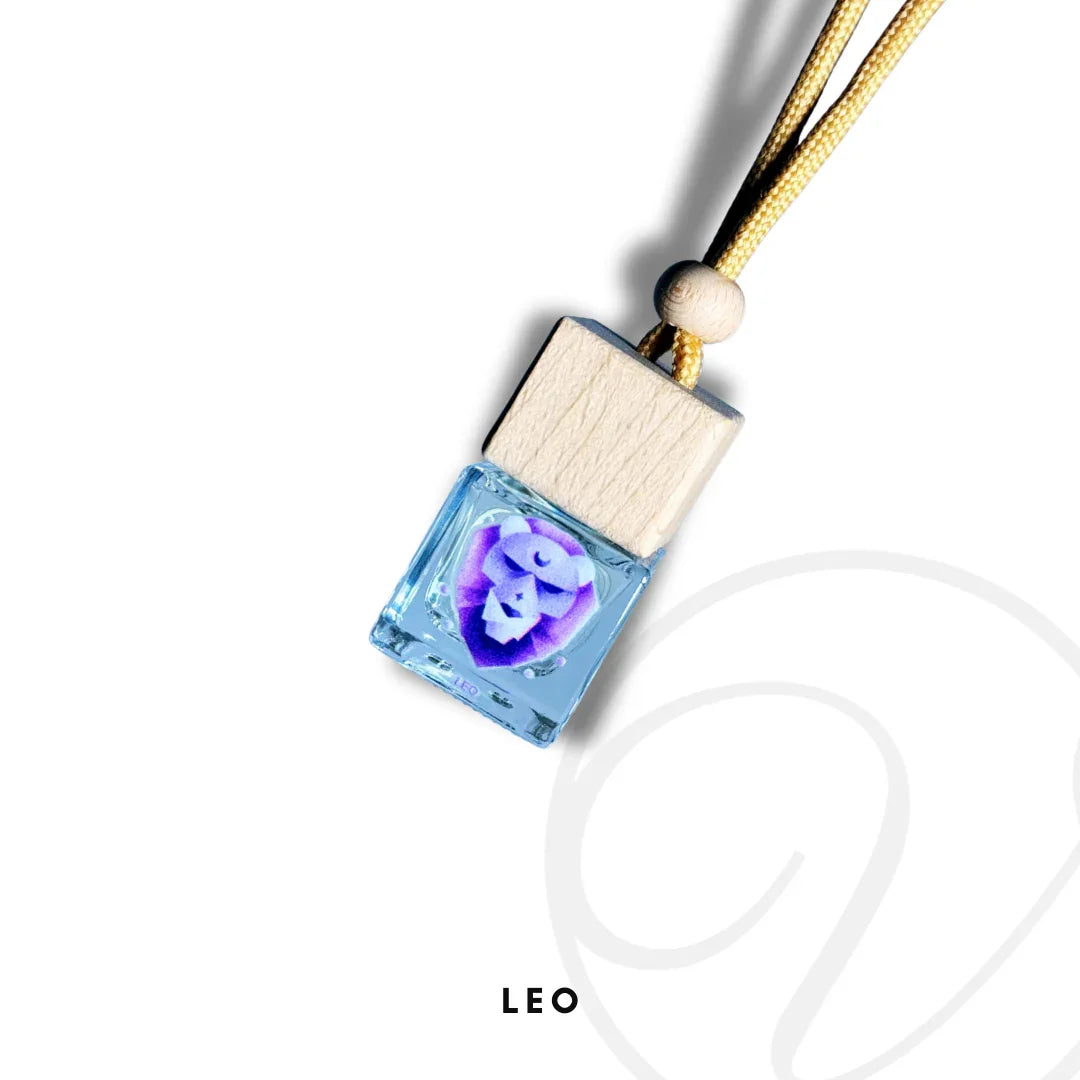 Blue fragrance diffuser bottle with wooden cap, zodiac Leo lion symbol, and hanging cord.