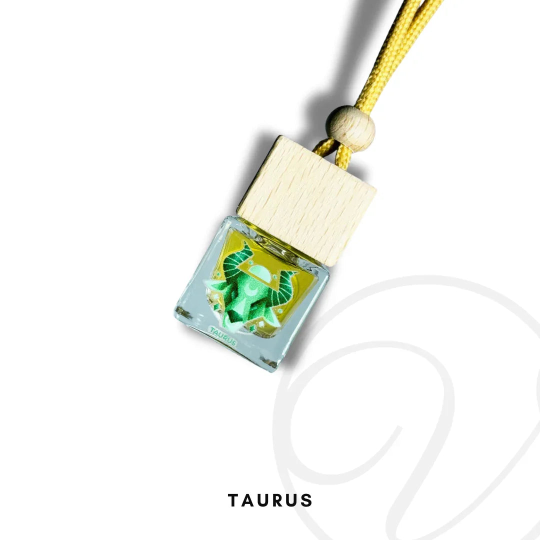 Taurus zodiac green air freshener with wooden cap and yellow cord on white background